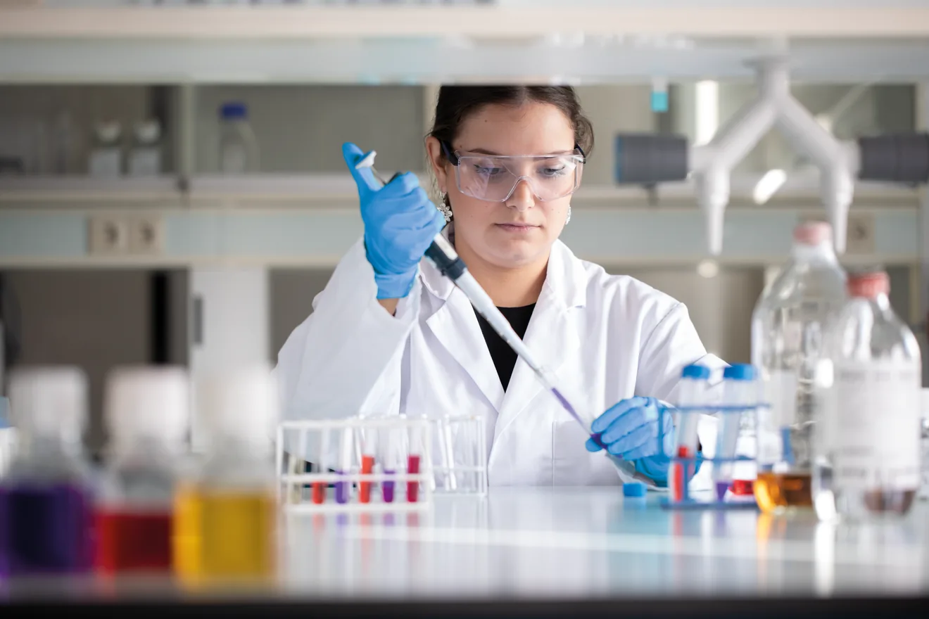 female worker pipetting