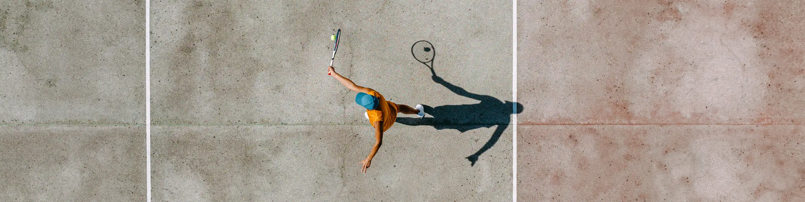 Man serving a tennis ball